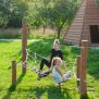Diamond net playground climbing structure with wooden posts and rope netting.